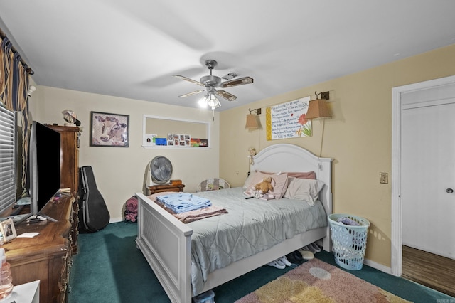 309 N Seaman St, Mccrory, AR 72101 - bedroom with dark carpet and a ceiling fan