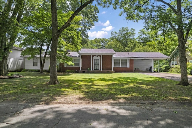 309 N Seaman St, Mccrory, AR 72101 - ranch-style home featuring driveway, brick siding, a front yard, a metal roof, and a carport