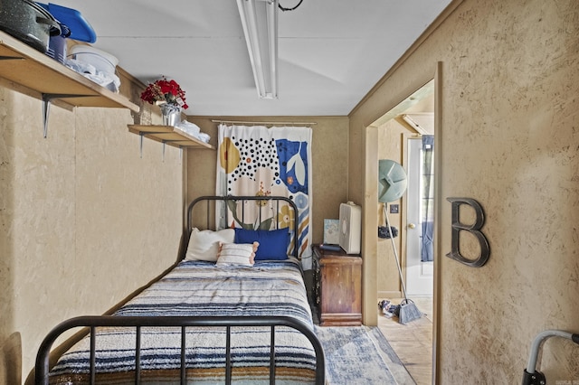 309 N Seaman St, Mccrory, AR 72101 - bedroom with a textured wall and wood finished floors