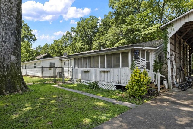 309 N Seaman St, Mccrory, AR 72101 - view of property exterior featuring a gate and a metal roof