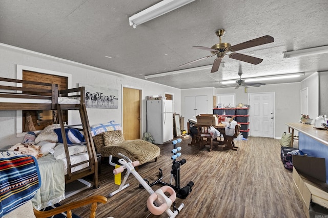309 N Seaman St, Mccrory, AR 72101 - bedroom featuring freestanding refrigerator and wood finished floors
