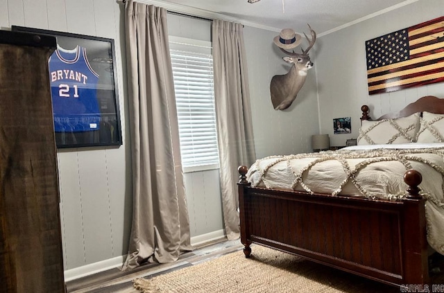 4 Paul St, Mcgehee, AR 71654 - bedroom with wood finished floors and crown molding