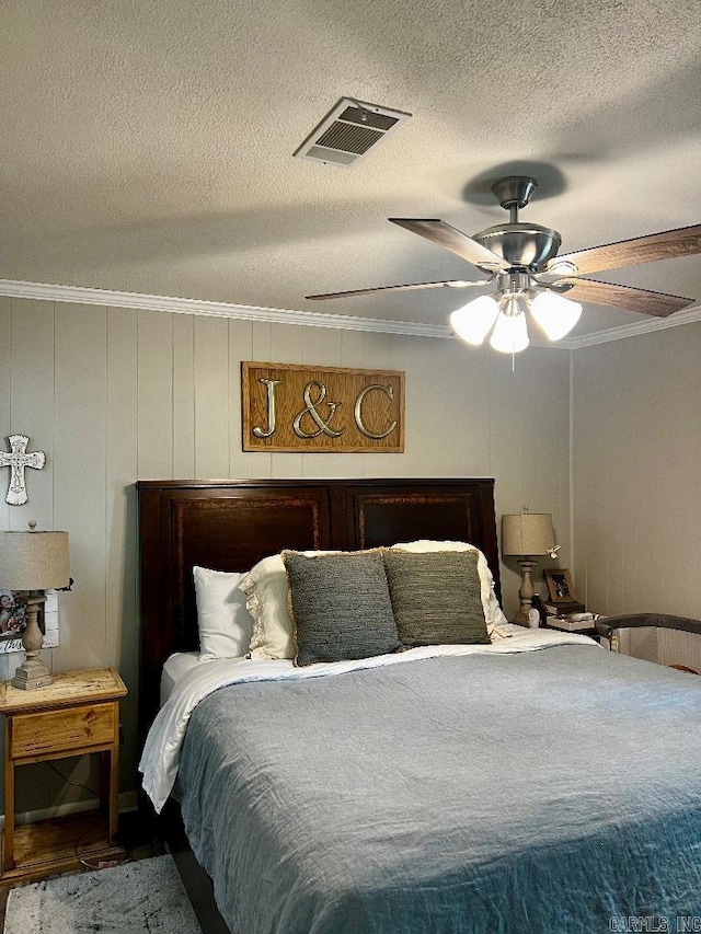 4 Paul St, Mcgehee, AR 71654 - bedroom with crown molding, a textured ceiling, and ceiling fan