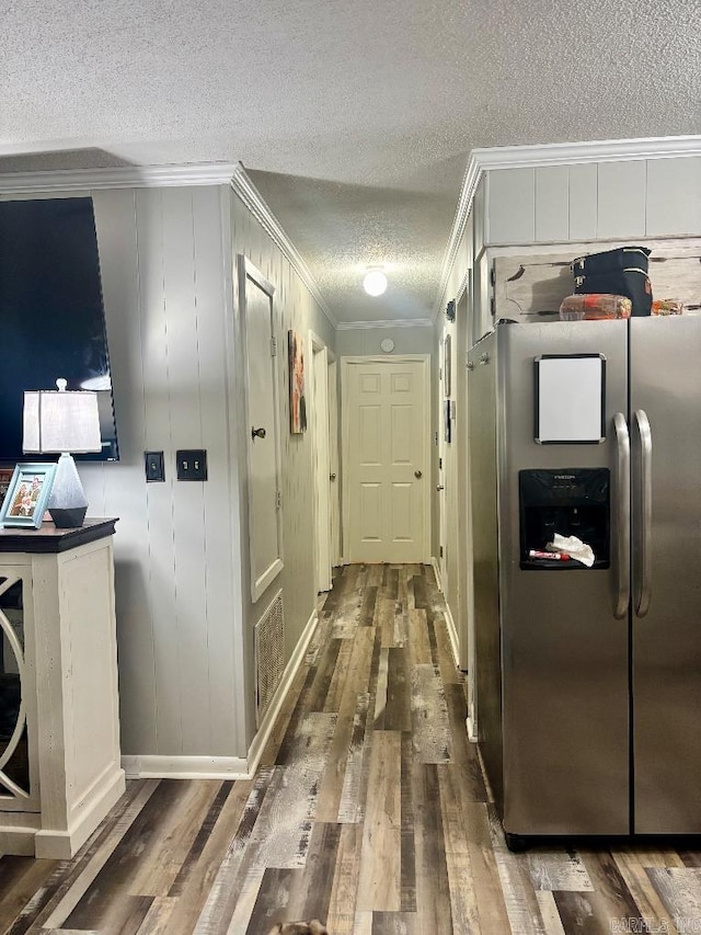 4 Paul St, Mcgehee, AR 71654 - corridor with a textured ceiling, crown molding, and wood finished floors