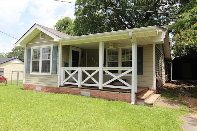 206 E Gum St, Sheridan, AR 72150 - rear view of property featuring a porch and crawl space