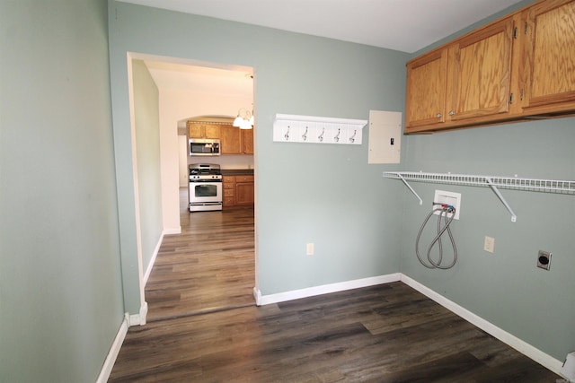 206 E Gum St, Sheridan, AR 72150 - washroom with hookup for a washing machine, hookup for an electric dryer, electric panel, cabinet space, and dark wood-style flooring