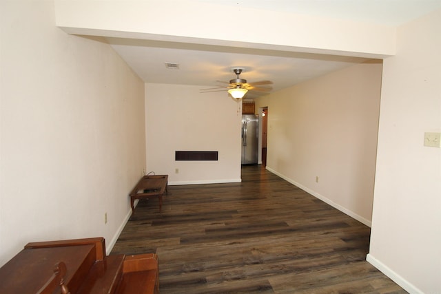 206 E Gum St, Sheridan, AR 72150 - empty room with ceiling fan and dark wood finished floors