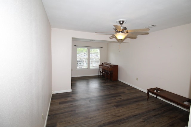 206 E Gum St, Sheridan, AR 72150 - empty room featuring dark wood finished floors and a ceiling fan