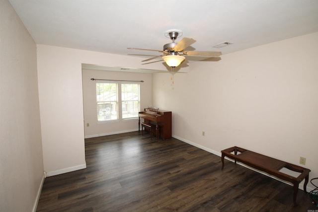 206 E Gum St, Sheridan, AR 72150 - spare room with dark wood-type flooring and ceiling fan