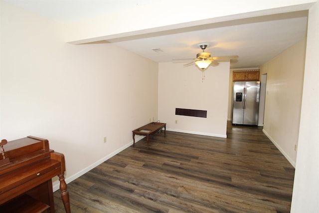 206 E Gum St, Sheridan, AR 72150 - unfurnished living room with dark wood-type flooring and ceiling fan
