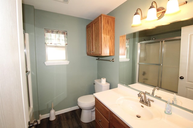 206 E Gum St, Sheridan, AR 72150 - bathroom with a shower with door, vanity, and wood finished floors
