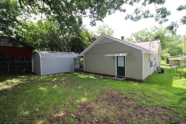 206 E Gum St, Sheridan, AR 72150 - rear view of property with a shed and a yard