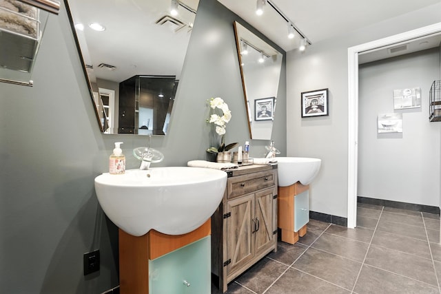 521 President Clinton Ave Unit 1101, Little Rock, AR 72201 - bathroom with vanity, rail lighting, and tile patterned floors