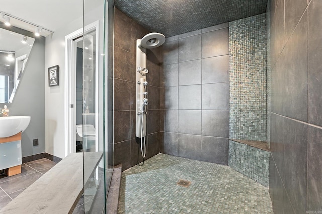 521 President Clinton Ave Unit 1101, Little Rock, AR 72201 - full bathroom with a tile shower, vanity, tile patterned floors, and track lighting