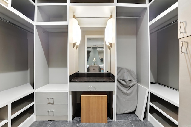 521 President Clinton Ave Unit 1101, Little Rock, AR 72201 - walk in closet featuring dark tile patterned floors