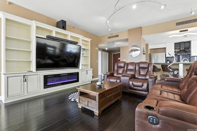 521 President Clinton Ave Unit 1101, Little Rock, AR 72201 - living room with dark wood-style flooring and built in shelves