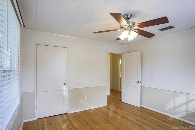 2615 Crouchwood, Little Rock, AR 72207 - unfurnished bedroom featuring crown molding, hardwood / wood-style flooring, and ceiling fan