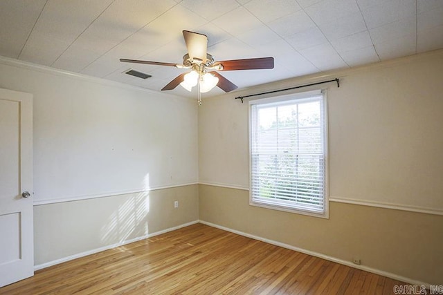2615 Crouchwood, Little Rock, AR 72207 - spare room with wood finished floors, ceiling fan, and crown molding