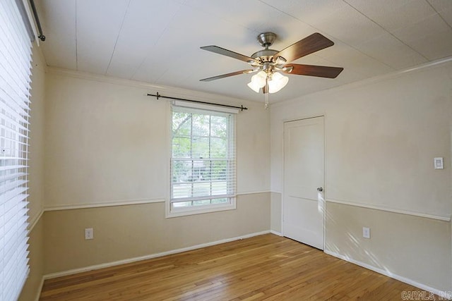 2615 Crouchwood, Little Rock, AR 72207 - empty room featuring wood finished floors, a ceiling fan, and ornamental molding