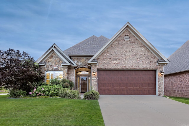 2300 Gordon Rd, Little Rock, AR 72223 - view of front of house with a garage, concrete driveway, a front lawn, brick siding, and stone siding