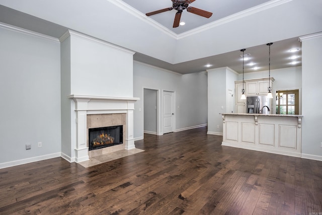 2300 Gordon Rd, Little Rock, AR 72223 - unfurnished living room featuring ceiling fan, crown molding, dark wood finished floors, a high end fireplace, and recessed lighting