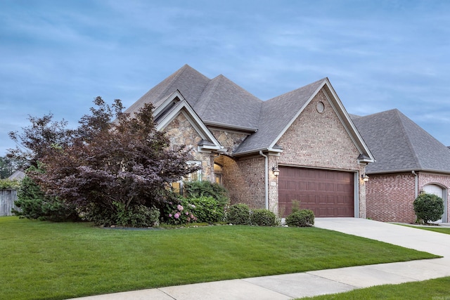 2300 Gordon Rd, Little Rock, AR 72223 - view of front of house with a garage, stone siding, driveway, and a front yard