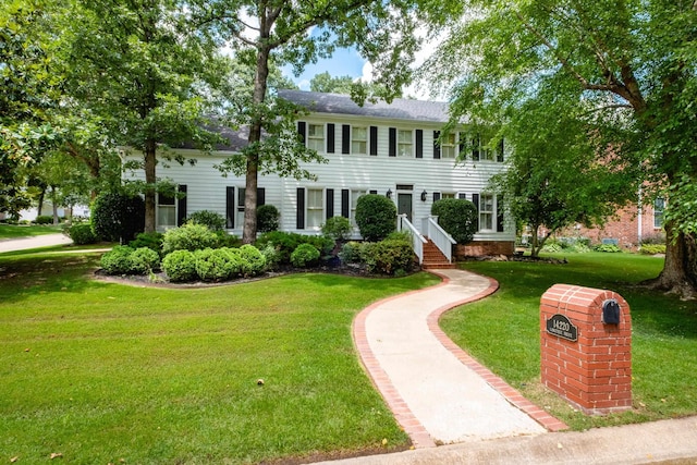 14220 Longtree Dr, Little Rock, AR 72212 - colonial inspired home featuring a front yard and a shingled roof