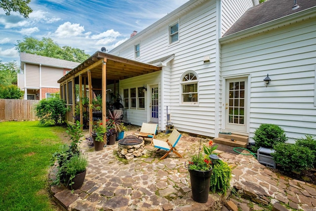 14220 Longtree Dr, Little Rock, AR 72212 - back of property with a fire pit and a patio area