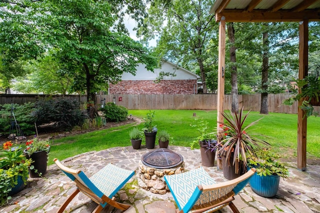 14220 Longtree Dr, Little Rock, AR 72212 - fenced backyard featuring a patio area and a fire pit