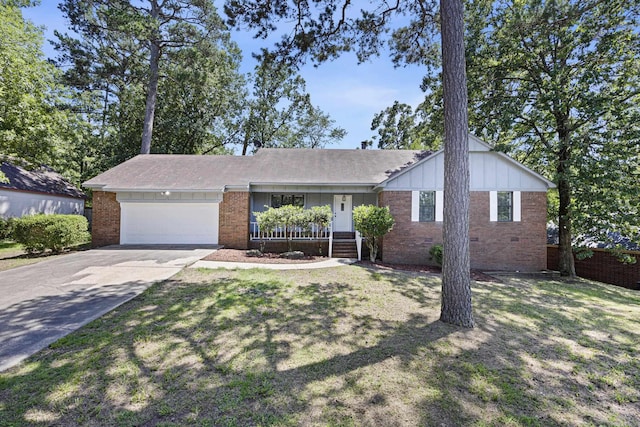 ranch-style house with brick siding, an attached garage, board and batten siding, concrete driveway, and a front yard