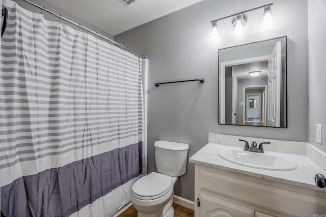 bathroom with vanity, wood finished floors, and a shower with shower curtain