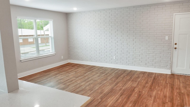 300 W Pleasure Ave, Searcy, AR 72143 - unfurnished room featuring wood finished floors and baseboards