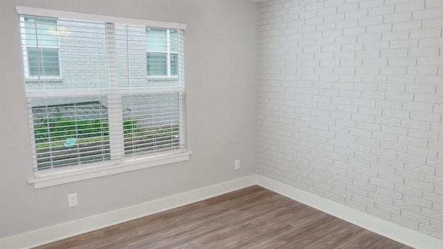 300 W Pleasure Ave, Searcy, AR 72143 - empty room with dark wood-style floors and baseboards