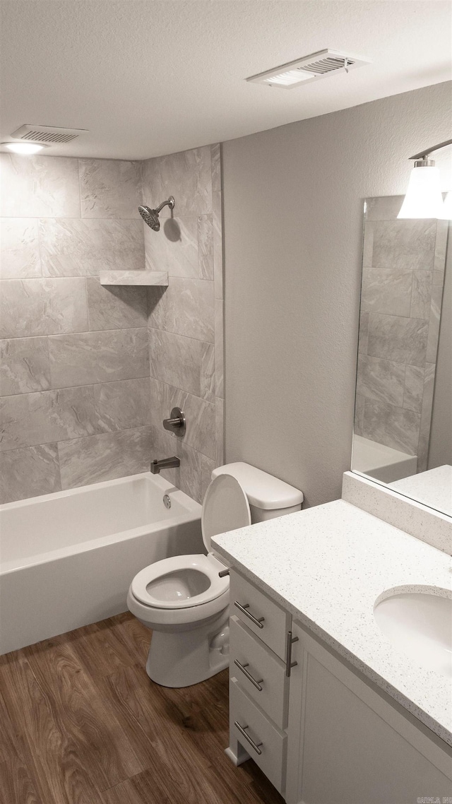 300 W Pleasure Ave, Searcy, AR 72143 - full bath with vanity, wood finished floors, bathing tub / shower combination, and a textured ceiling