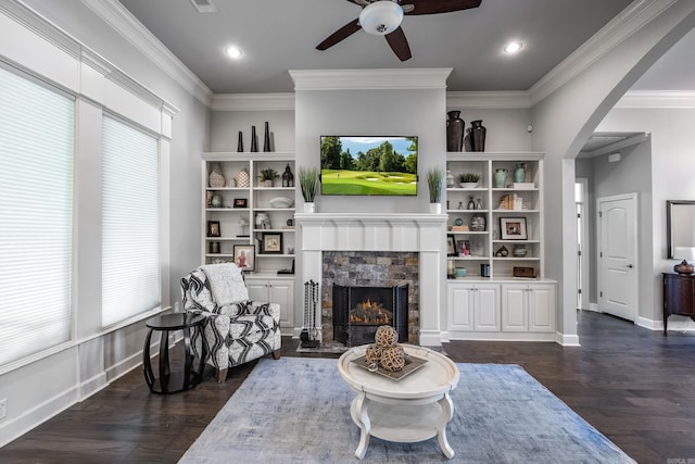 21 Ensbury Pl, Little Rock, AR 72223 - living area with a ceiling fan, arched walkways, dark wood-style flooring, a fireplace, and ornamental molding