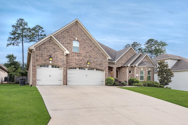 21 Ensbury Pl, Little Rock, AR 72223 - view of front of property with concrete driveway, brick siding, and a front lawn