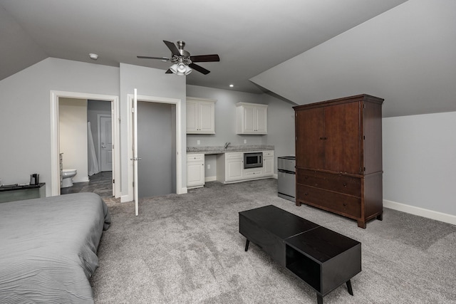 21 Ensbury Pl, Little Rock, AR 72223 - bedroom featuring vaulted ceiling, light colored carpet, ensuite bathroom, and a ceiling fan