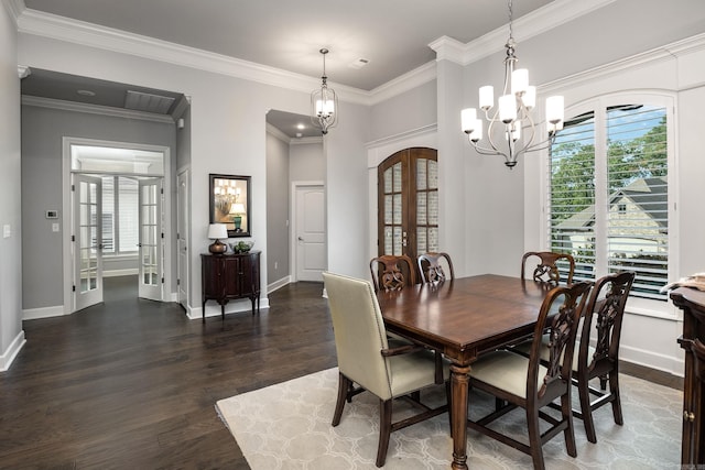 21 Ensbury Pl, Little Rock, AR 72223 - dining space with a chandelier, wood finished floors, french doors, ornamental molding, and arched walkways