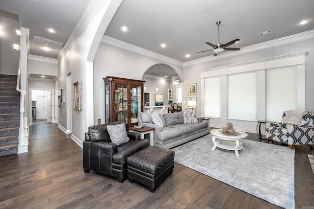 21 Ensbury Pl, Little Rock, AR 72223 - living area featuring arched walkways, ceiling fan, dark wood finished floors, stairs, and crown molding
