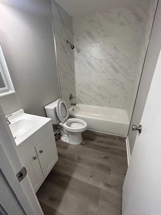709 Melody Ln, Searcy, AR 72143 - bathroom featuring vanity, wood finished floors, and washtub / shower combination