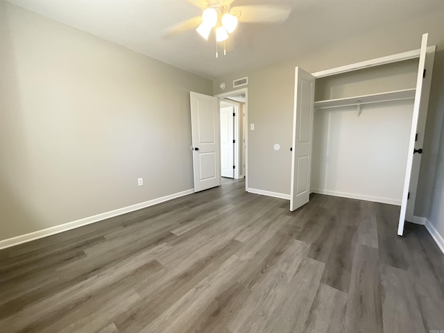 709 Melody Ln, Searcy, AR 72143 - unfurnished bedroom featuring dark wood-style flooring, a closet, and a ceiling fan