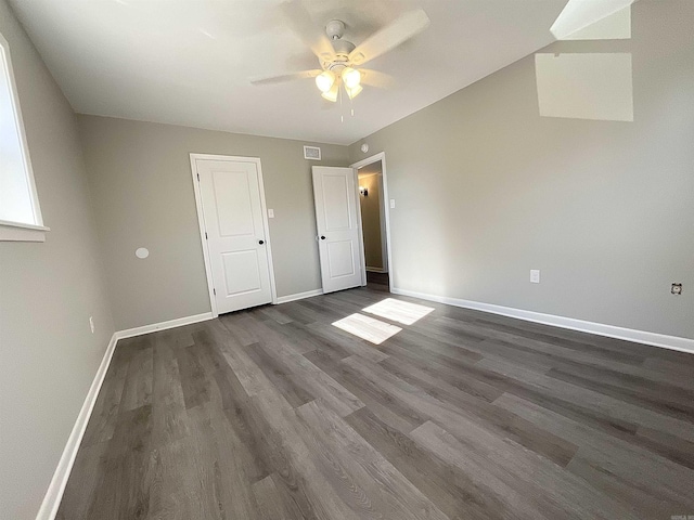709 Melody Ln, Searcy, AR 72143 - unfurnished bedroom with dark wood-type flooring and a ceiling fan