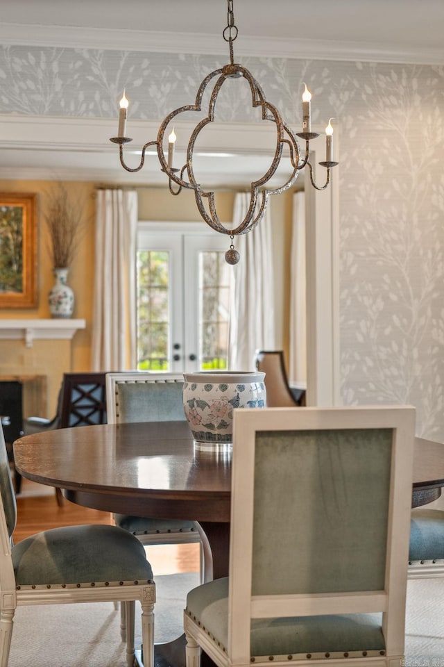 1811 N Jackson St, Little Rock, AR 72207 - dining space with wallpapered walls, crown molding, and french doors