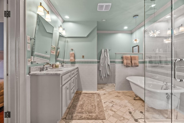 1811 N Jackson St, Little Rock, AR 72207 - full bathroom with crown molding, double vanity, a freestanding tub, a shower stall, and tile walls
