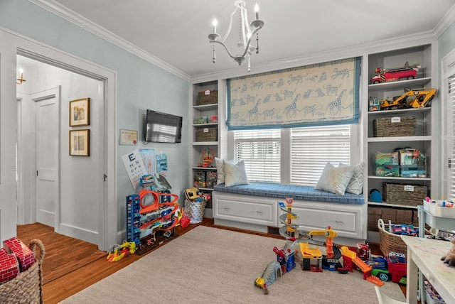 1811 N Jackson St, Little Rock, AR 72207 - rec room with crown molding, a chandelier, and wood finished floors
