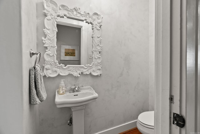 1811 N Jackson St, Little Rock, AR 72207 - bathroom with toilet and wood finished floors