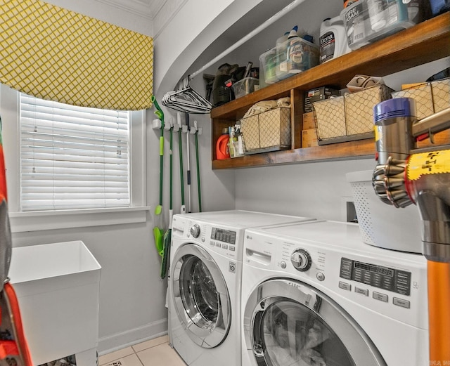 1811 N Jackson St, Little Rock, AR 72207 - washroom featuring washer and clothes dryer, light tile patterned flooring, and ornamental molding