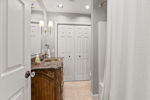 1811 N Jackson St, Little Rock, AR 72207 - full bathroom with a closet, vanity, shower / bathtub combination with curtain, and tile patterned flooring