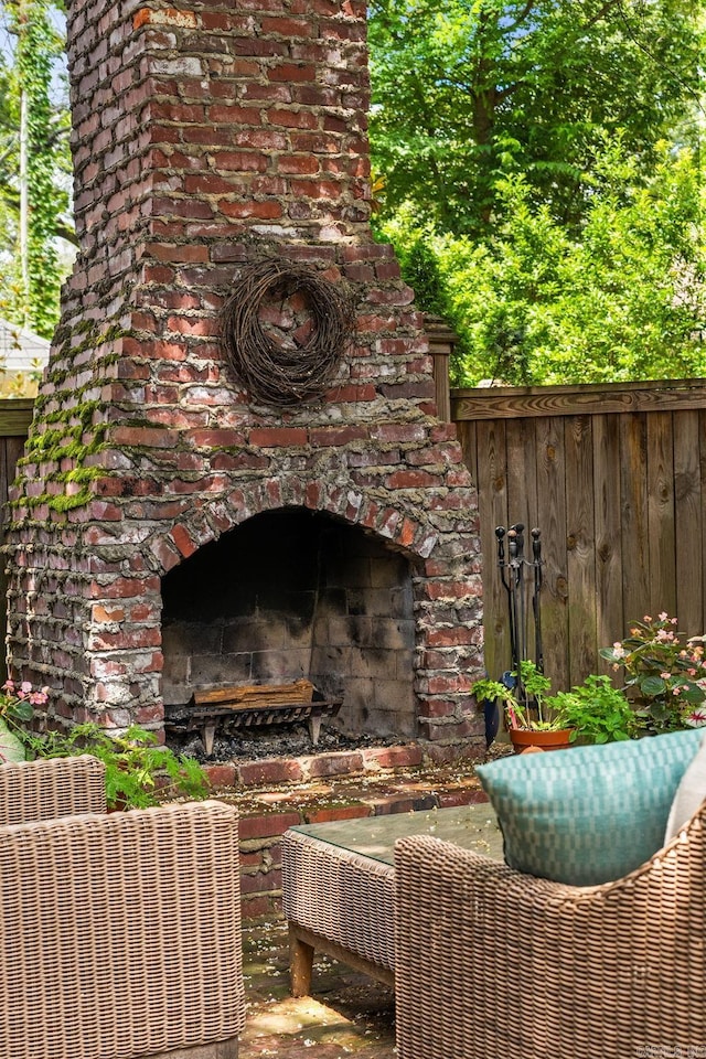 1811 N Jackson St, Little Rock, AR 72207 - view of patio featuring an outdoor brick fireplace