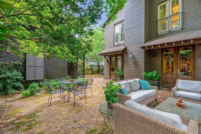 1811 N Jackson St, Little Rock, AR 72207 - view of patio featuring french doors, an outdoor hangout area, and outdoor dining area
